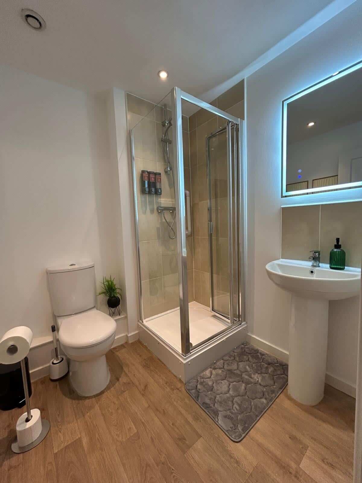 Shower, hair dryer, towels, shampoo