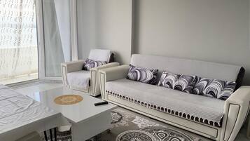 Standard Apartment, Multiple Beds, Balcony, Sea View | Living area