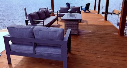 Peaceful lake house retreat with hot tub, dock, and fire pit.