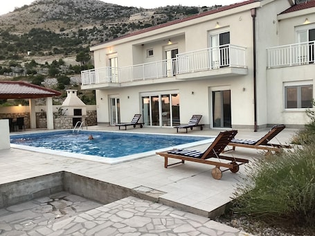 Outdoor pool. Spacious 5-bedroom villa in soothing Ivanica near Dubrovnik with private pool
