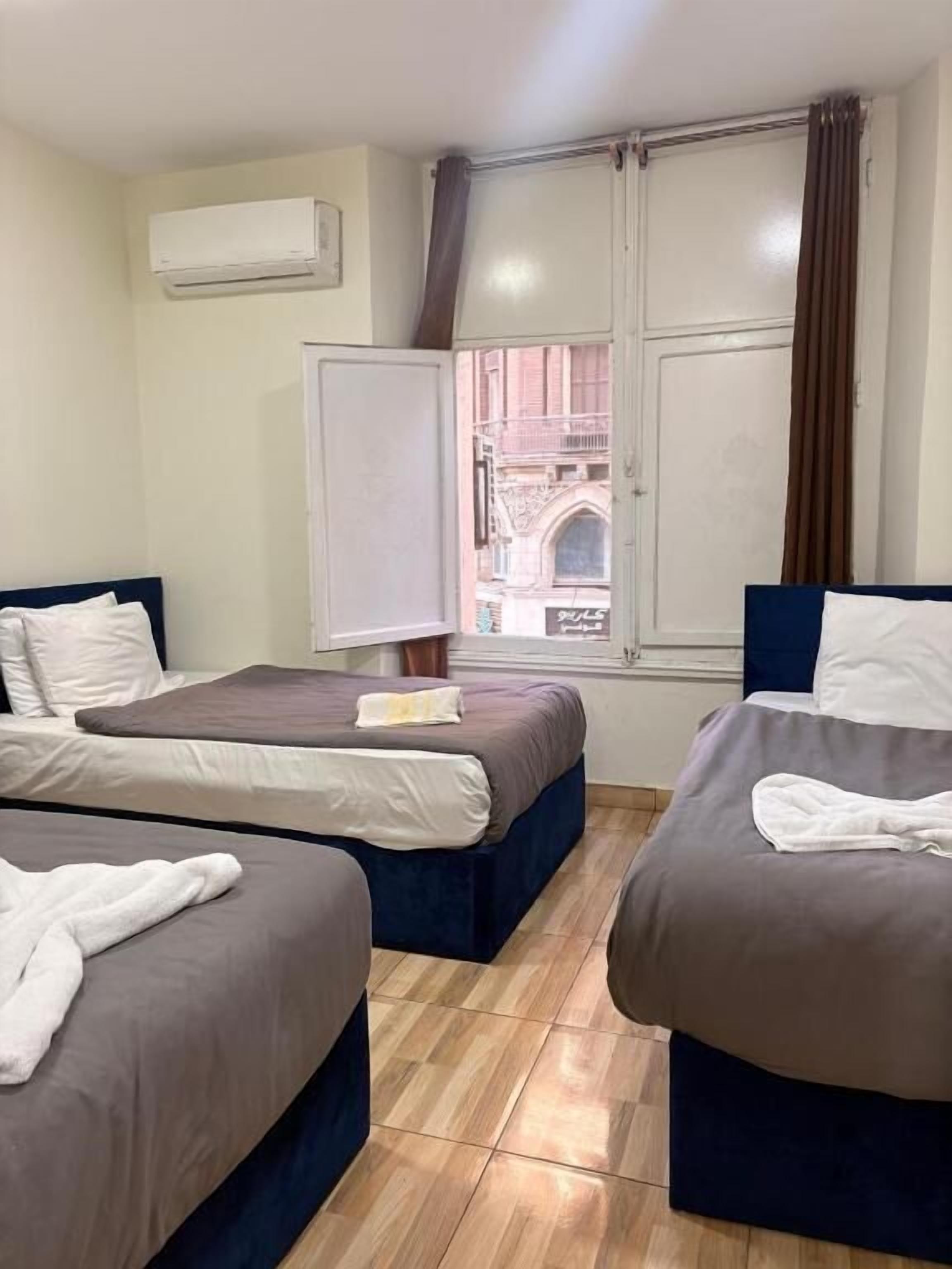 Quarto triplo, vista para a cidade