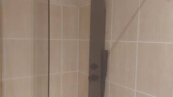 Shower, hair dryer, towels, toilet paper