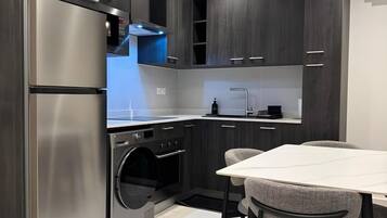 Luksussuite, balkong, byutsikt | Eget kjøkken