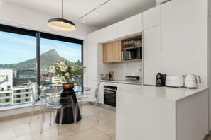 Fridge, microwave, oven, stovetop - Contemporary 2 Bed Apartment | The Rubik (Cape Town)
