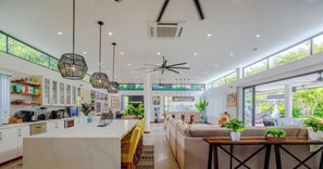 A spacious kitchen with white cabinets, a central island, and pendant lighting. - "La Chula" Fantástica Mansión de Lujo by TopSpot® (La Vega Arriba)