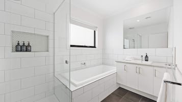 Shower, hair dryer, towels, shampoo