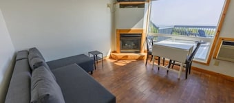 Resort room with two beds and a full kitchen and hottub access