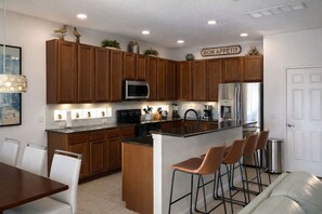 Fridge, microwave, oven, stovetop - Villa Resort 7BR: Theater, Heated Pool/Spa, Arcade (Davenport)