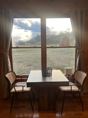 Dining - 2-bedroom cabin located on a working bee farm and stocked trout stream. (Rural Retreat)