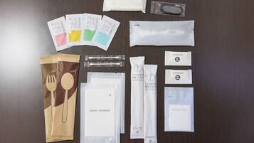 A variety of personal care items laid out on a wooden surface.