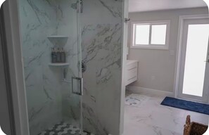 Shower, hair dryer, towels, soap