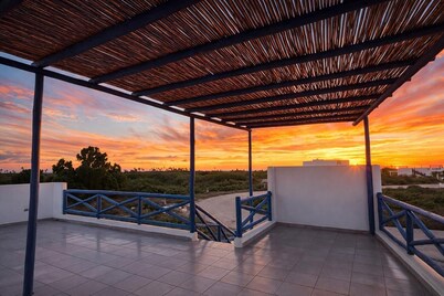 Private home with jacuzzi and large terrace steps from the beach
