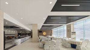 A modern hotel lobby with a reception desk, seating area, and large windows. - Golden Phoenix PEK Airport T3 Beijing (Beijing)