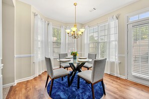 Dining - 3-bedroom townhome in pleasant Lawrenceville with AC for relaxing stays (Lawrenceville)