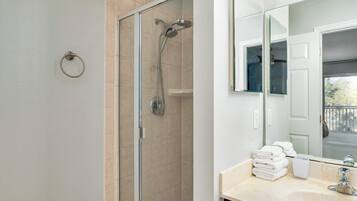 Shower, hair dryer, towels, shampoo
