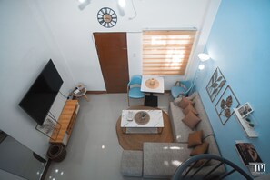 Deluxe Studio, Kitchen | Living area - Woodlands Condotel (Bulan)