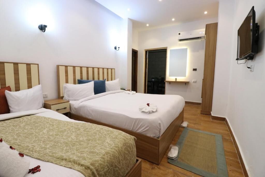 Quarto triplo luxo, vista para o pátio