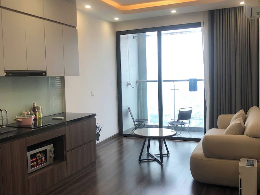 Apartamento família, sacada, vista para a cidade | Área de estar