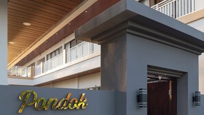 A building entrance with a sign reading 'Pondok Uma Jero' and a wooden ceiling. - Pondok Uma Jero (Tabanan)