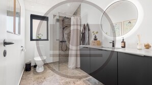 A modern bathroom with a shower, toilet, and vanity. - Amazing home in Hemmet with sauna (Hemmet)