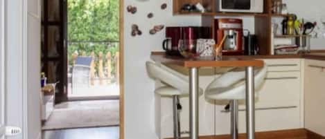 Fridge, microwave, stovetop, coffee/tea maker