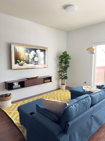 Living area. The Boho-Chic Urban Retreat: 3BR Haven Near Downtown & General Hospital