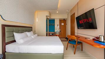 Premium bedding, memory-foam beds, free minibar items, desk
