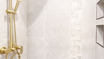 Shower, towels, soap, toilet paper