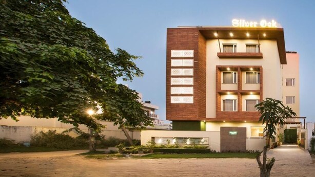 A hotel named "Silver Oak" with a modern design, featuring a brick facade and multiple windows. - SILVER OAK (Gurugram)