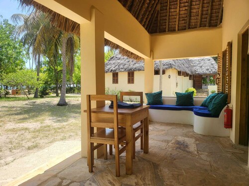 Comfortable beach villa, located directly by the sea, tropical garden