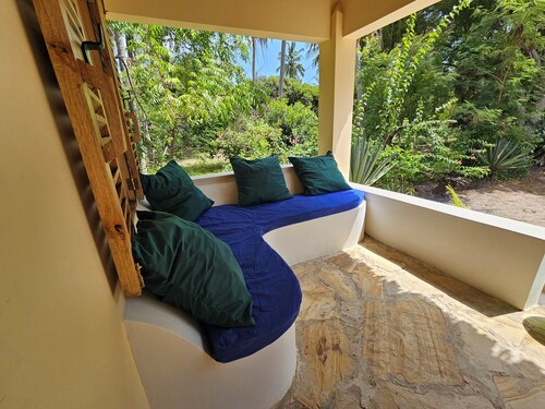 Comfortable beach villa, located directly by the sea, tropical garden