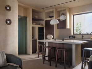 A modern kitchen with a central island, bar stools, and pendant lighting. - Galithea Villa, Heated Pool & Marathonisi SeaViews (MR9X+3X4 Laganas, Greece)