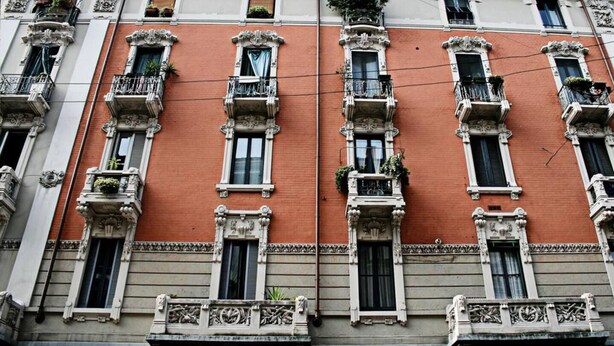 A multi-story building with ornate balconies, large windows, and decorative moldings. - Elegant and quiet little gem in downtown milan (M4 DATEO) (Milano)