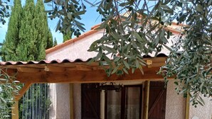A wooden deck with a blue bar counter and four stools. - Luxury villa with amazing views in 3200m2 (Laroque-des-Albères)