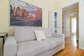 Living area - GuestHost - Modern 40m2 apartment, perfect for 4 people, located on the second floor of a building with lift.The accommodation is located in the Bocconi/Tibaldi district, a vibrant and strategic area, defined by the prestigious presence of the Bocconi Un (Milan)