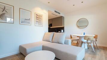 Signature Apartment, 1 Queen Bed with Sofa bed, Pool View | Living area | 120-cm LED TV with digital channels