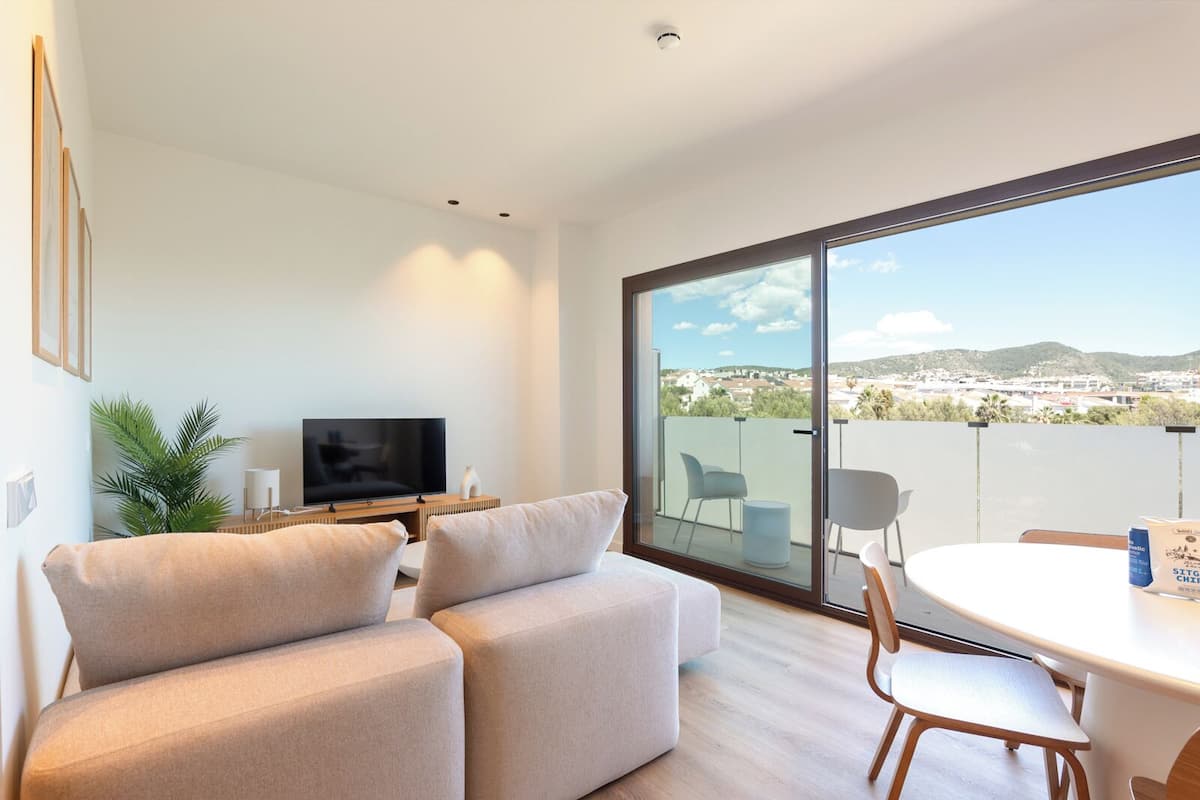 Signature Apartment, 1 Queen Bed with Sofa bed, City View | Living area | 120-cm LED TV with digital channels
