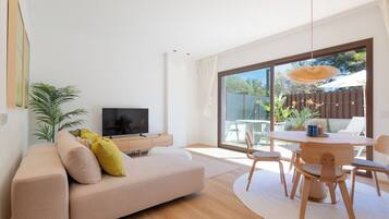 Signature Apartment, 1 Queen Bed with Sofa bed, City View | Living area | 120-cm LED TV with digital channels