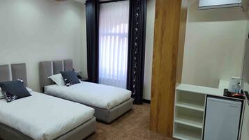 Eenvoudige kamer, 1 twee- of 2 eenpersoonsbedden