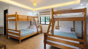 A room with bunk beds, a ceiling light, and a window. - Lisro Sleep And Relax La Union near Beach (San Juan)