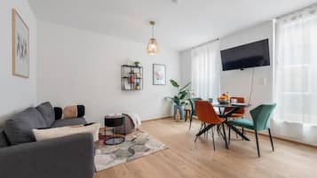 Apartment, 1 King-Bett und Schlafsofa | Wohnbereich | Flachbildfernseher