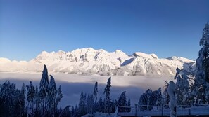 A snow-covered mountain range with a clear sky.
