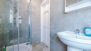 Shower, towels, soap, toilet paper
