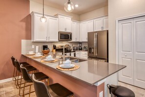Fridge, microwave, oven, stovetop - Modern 2BR Condo w/ Mickey Room - Family Perfection (Four Corners)