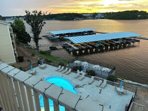 A waterfront property with a pool, outdoor seating, and a dock with boats. -
Penthouse with an open balcony. Greatest Location, Boat Slip upon request only (Osage Beach)