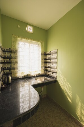 Deluxe Quadruple Room, City View | Interior - Lotus Leaf Guest House (Guwahati)