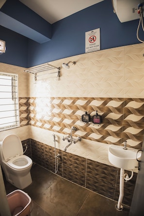 Deluxe Quadruple Room, City View | Bathroom | Shower, towels, soap, shampoo - Lotus Leaf Guest House (Guwahati)