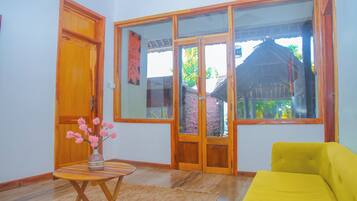 Appartement Deluxe, vue jardin | Coin séjour