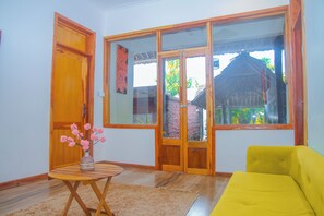 Appartement Deluxe, vue jardin | Coin séjour