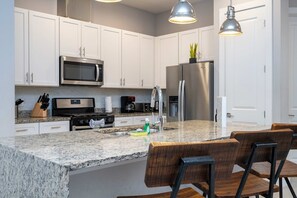 Fridge, microwave, oven, stovetop - Modern Chic Home, Mickey and Toy Story Rooms (Four Corners)
